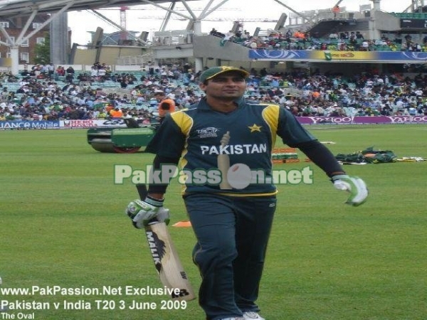 Shahzaib Hasan walks off the field after batting practice