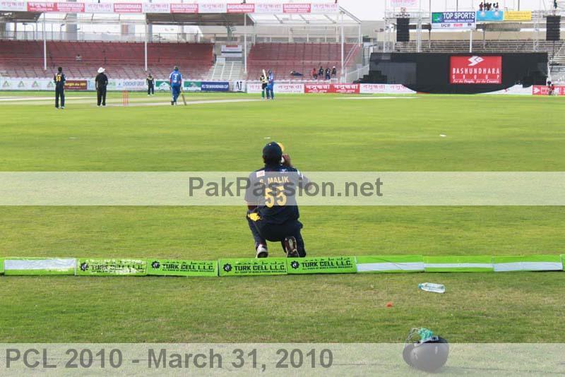 Shoaib Malik drinks some water while fielding