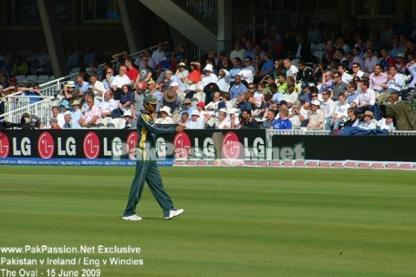 Shoaib Malik walks back to his fielding position