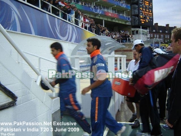 Suresh Raina and Rohit Sharma walk back to the dressing room