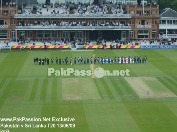 The Pakistani and Sri Lankan teams line up for the national anthems