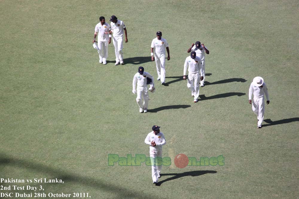 The Sri Lankan team head to the pavillion