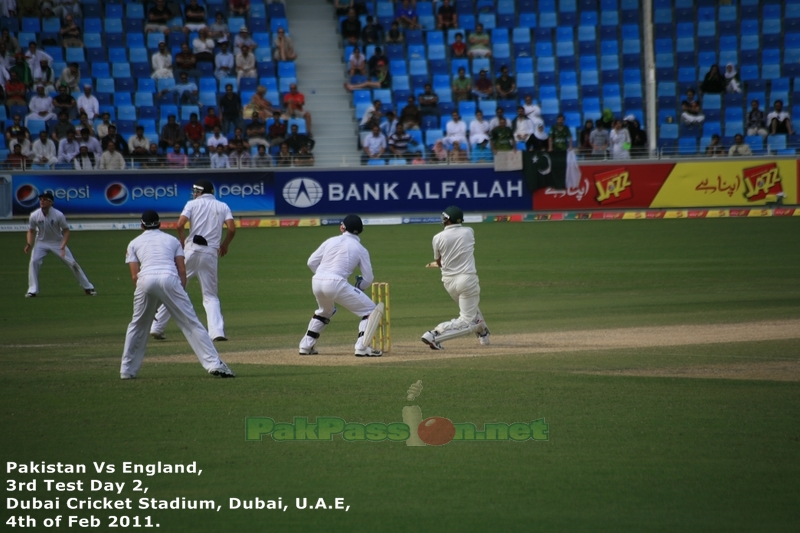 Younis Khan plays a shot and everyone looks towards the ball