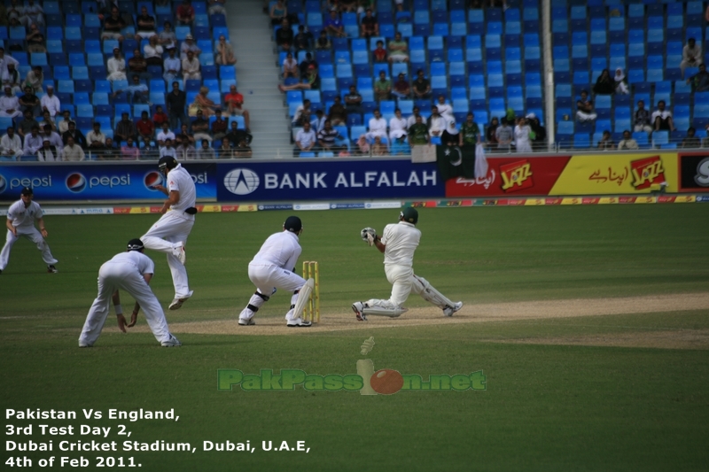 Younis Khan's sweep shot nearly takes out Alastair Cook on short leg