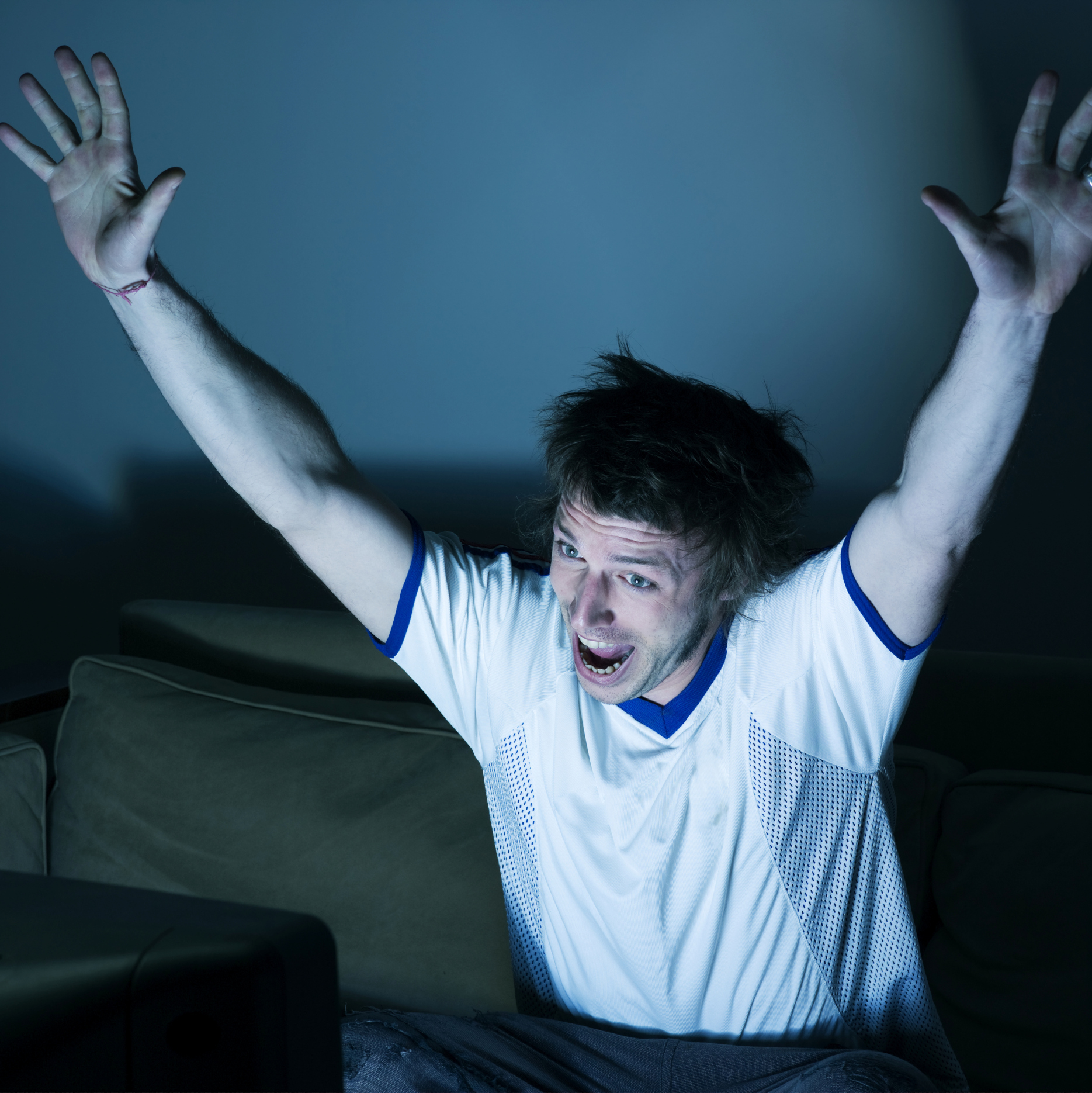 man-cheering-while-watching-TV.jpg