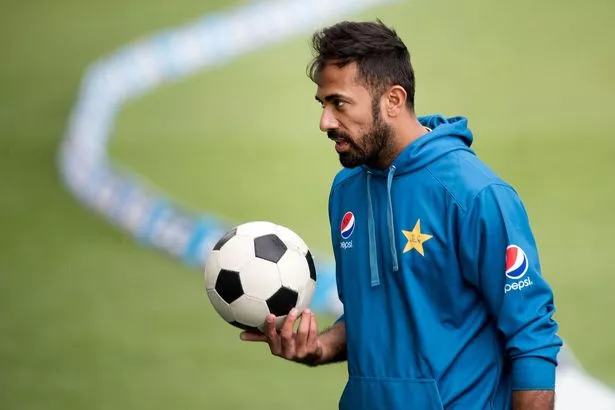 Pakistans-Wahab-Riaz-holds-a-football-a.jpg