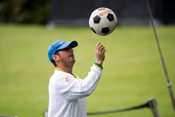 Pakistans-Yasir-Shah-plays-with-a-footb.jpg